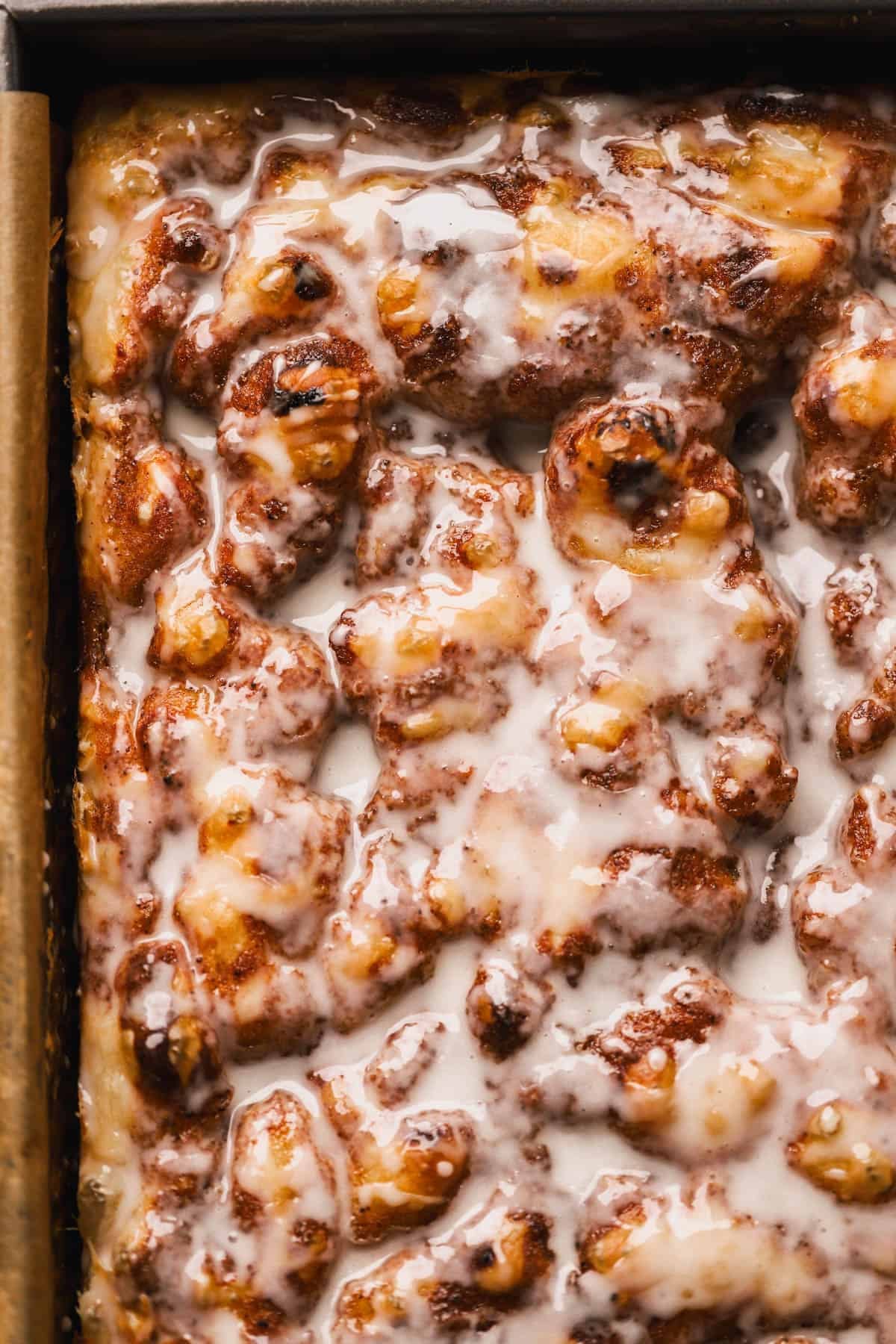 Cinnamon Focaccia is a yeast dough, made with brown butter and topped with cinnamon sugar and vanilla glaze.