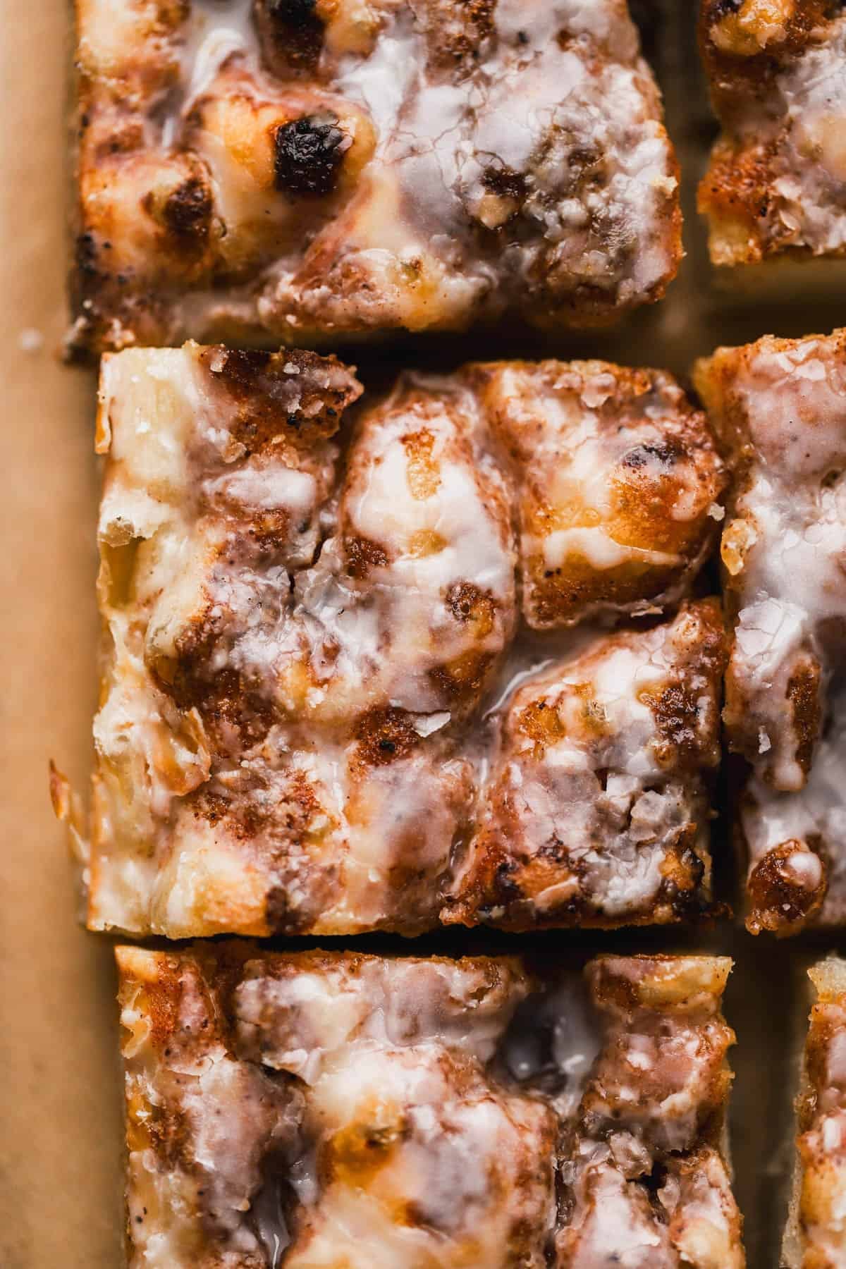 Cinnamon Focaccia is a yeast dough, made with brown butter and topped with cinnamon sugar and vanilla glaze.