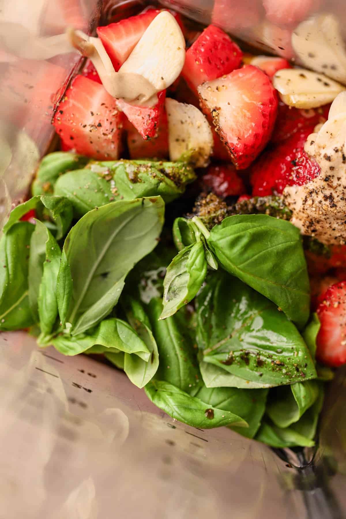 Fresh basil, garlic, strawberries, dijon, honey, balsamic, salt and pepper.