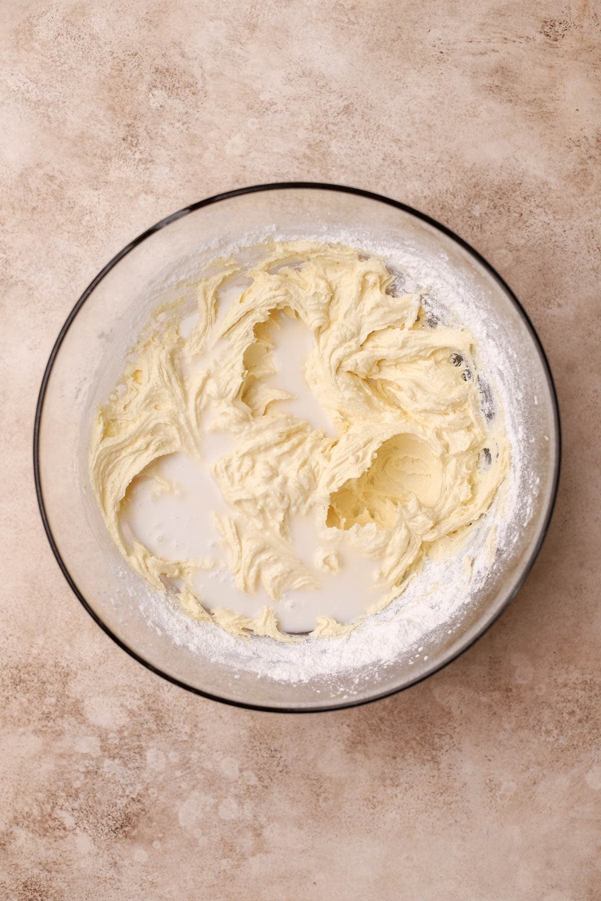 Whipped butter, sugar, oil, eggs, vanilla, flour, salt, baking powder, and coconut milk. 