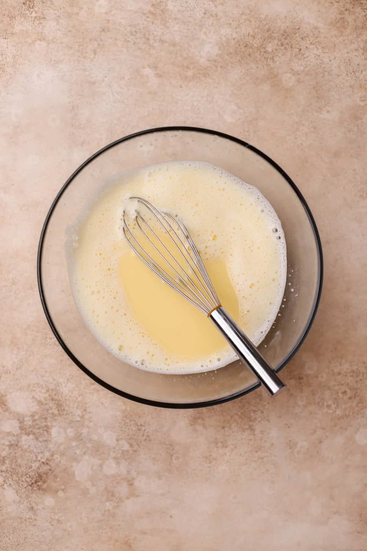 Whole milk, egg yolks, sugar, and flour. 