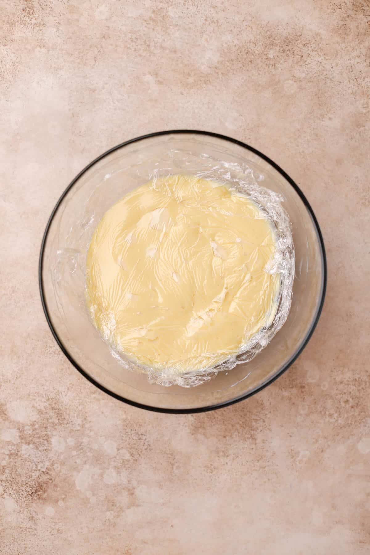 Finished pastry cream covered with plastic wrap. 