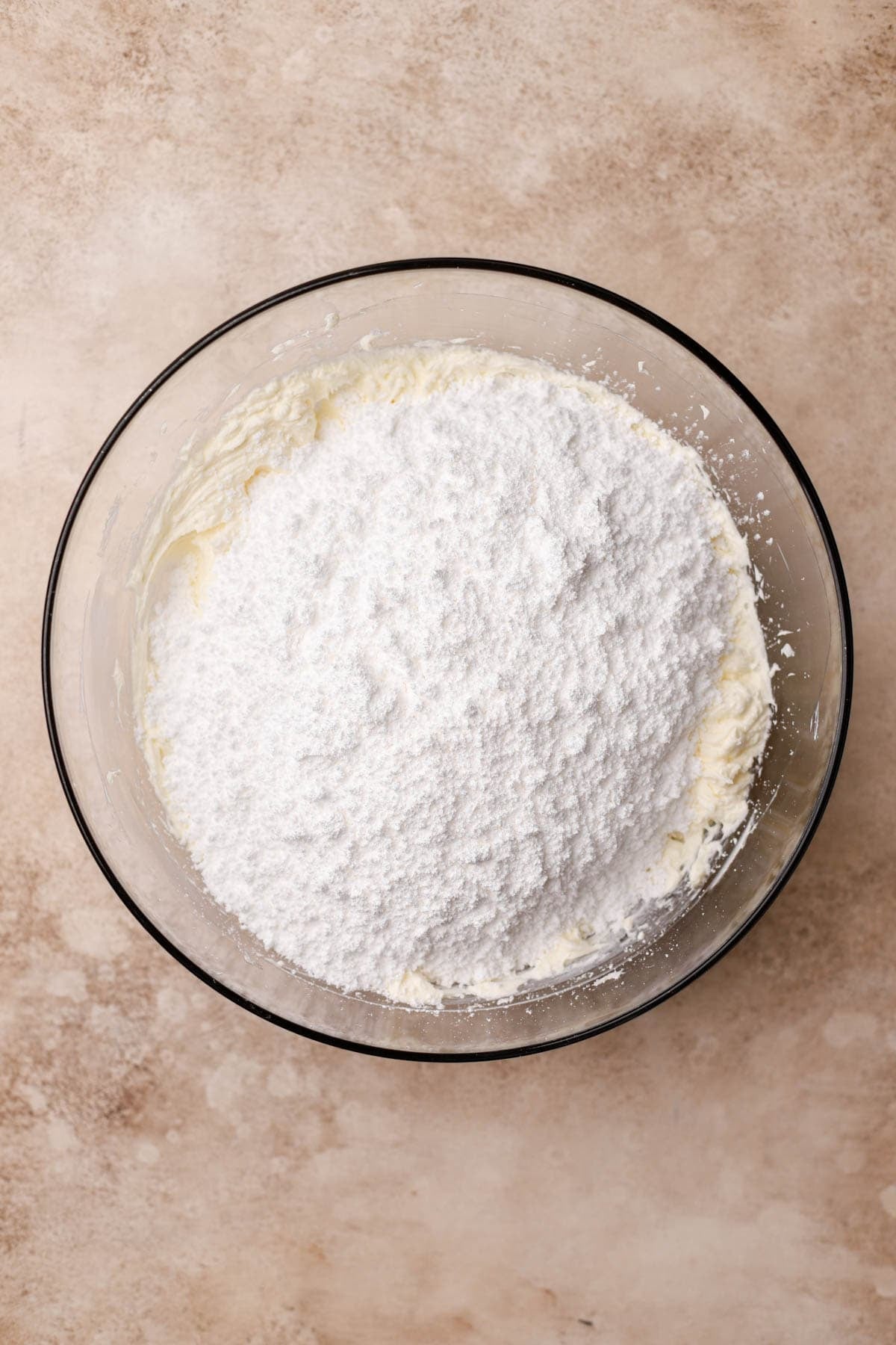 Whipped butter, cream cheese powdered sugar, coconut extract and vanilla. 