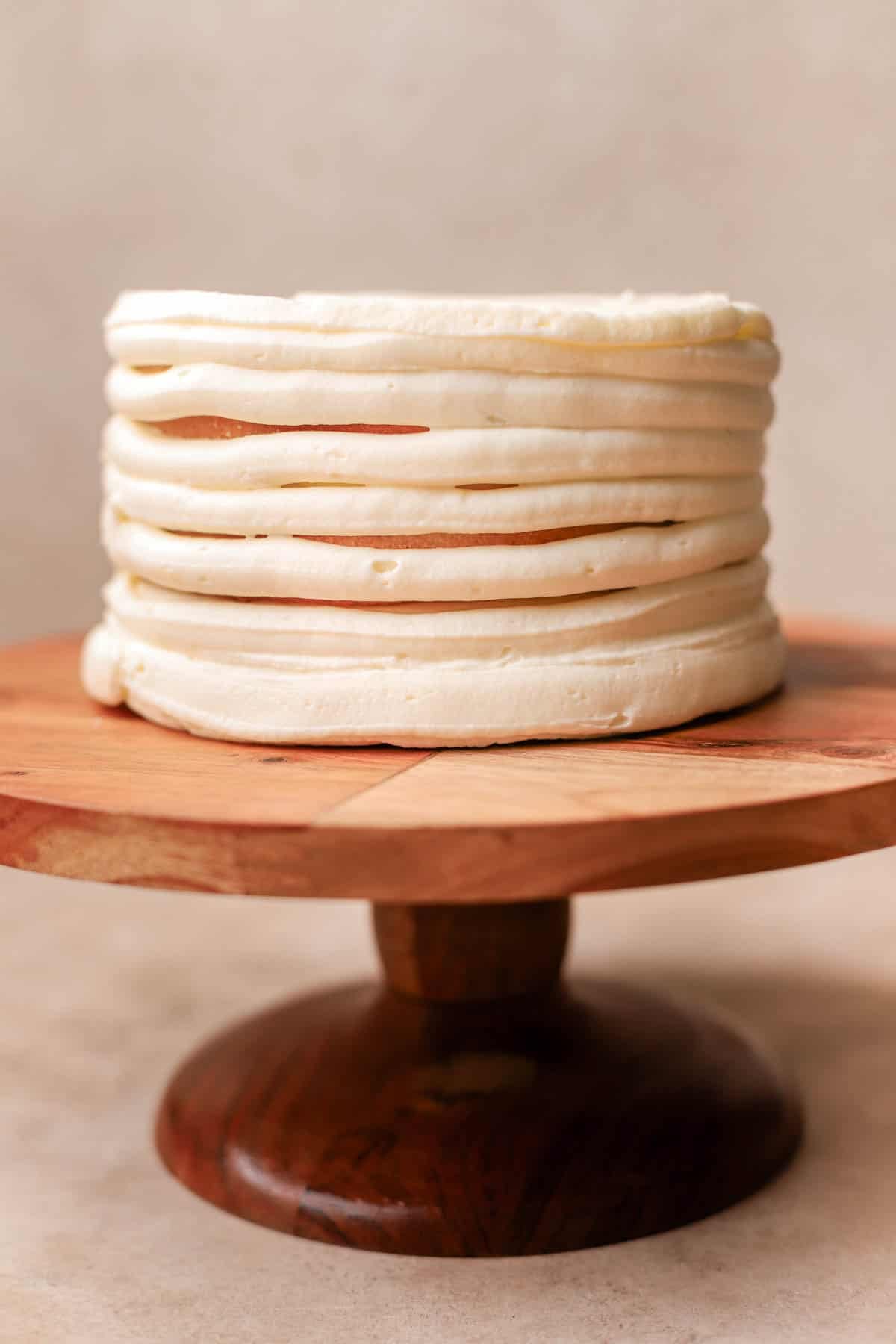 Coconut cake frosted with cream cheese frosting. 