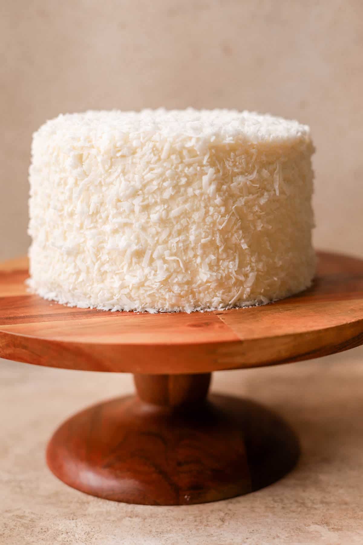 Coconut cake coated in shredded coconut. 