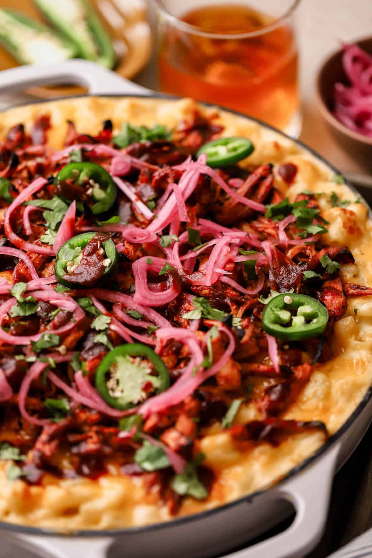 BBQ Chicken Mac and Cheese with cheddar cheese, jalapeno peppers, pickled onions, and fresh cilantro. 