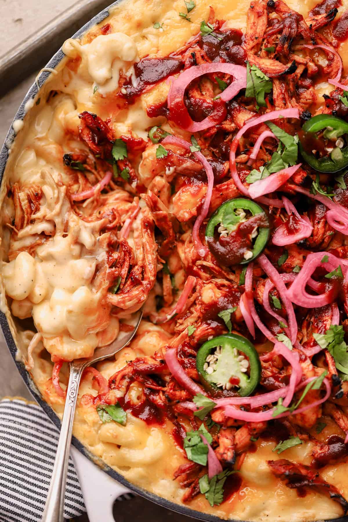 BBQ Chicken Mac and Cheese with cheddar cheese, jalapeno peppers, pickled onions, and fresh cilantro. 