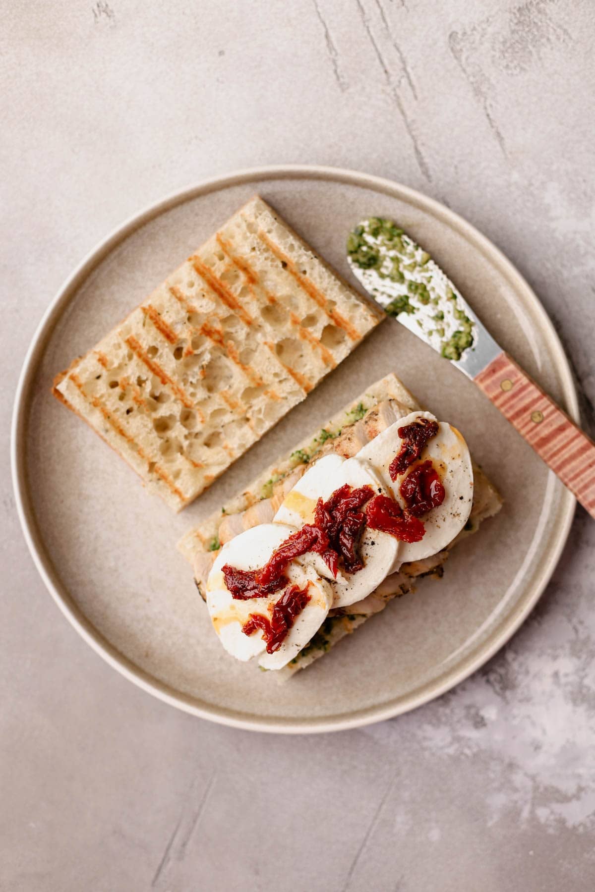 Grilled focaccia with homemade basil spread, grilled chicken, and sun-dried tomatoes.