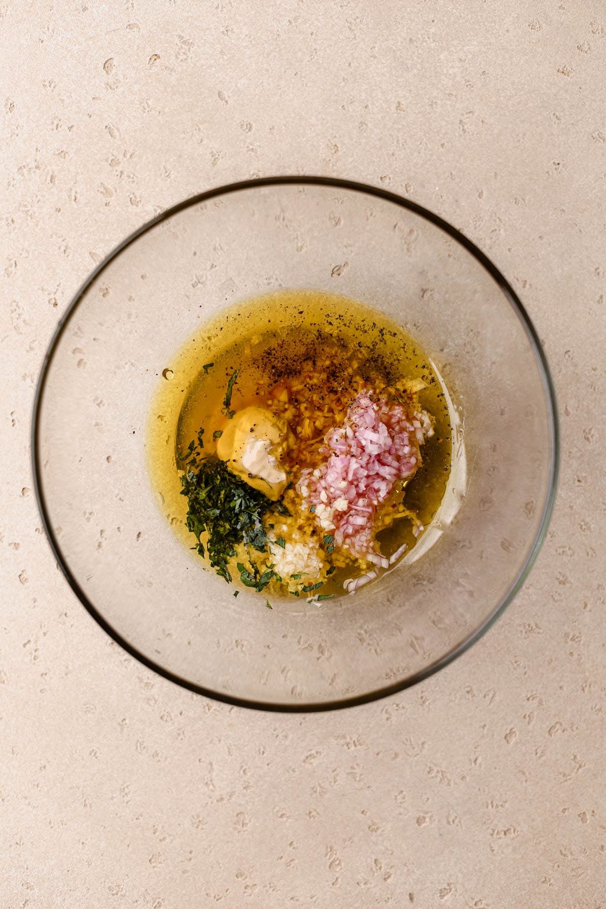 Extra virgin olive oil, tarragon, shallots, garlic, dijon, honey, and tarragon vinegar. 