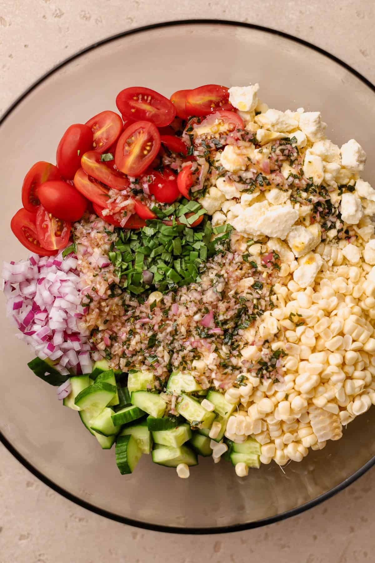 Cooked quinoa, grape tomatoes, feta, red onion, basil, cucumbers, fresh corn, tarragon-honey vinaigrette. 