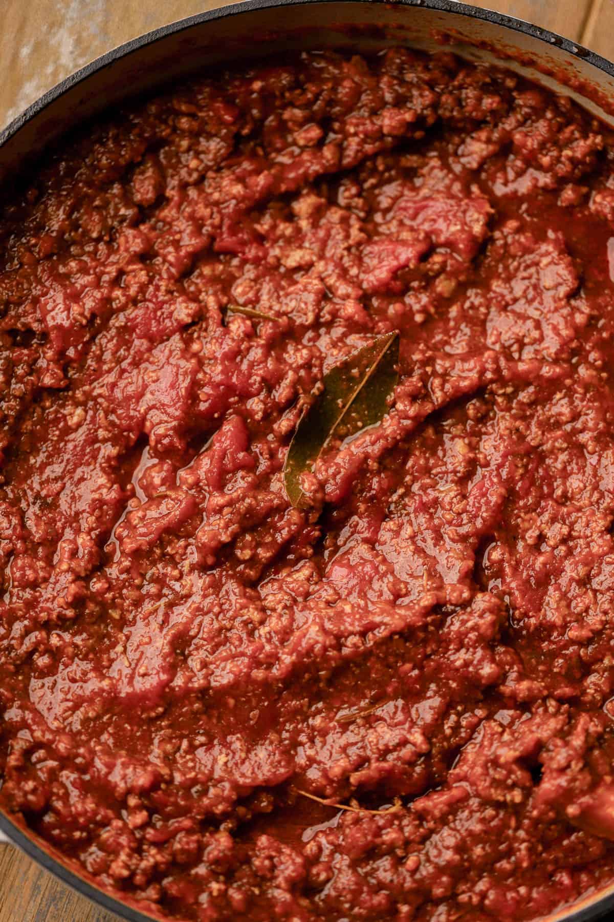 Spicy bolognese is made with ground beef, pancetta, spicy Italian sausage, red pepper flakes, fresh herbs, vegetables, tomatoes and red wine.  