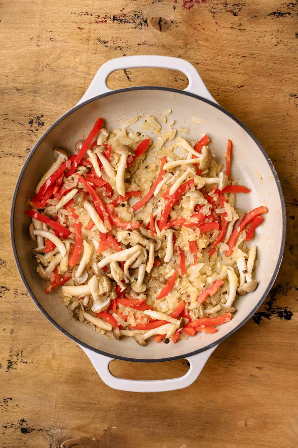 Sauteed onions, garlic, ginger, beech mushrooms, and red bell peppers. 
