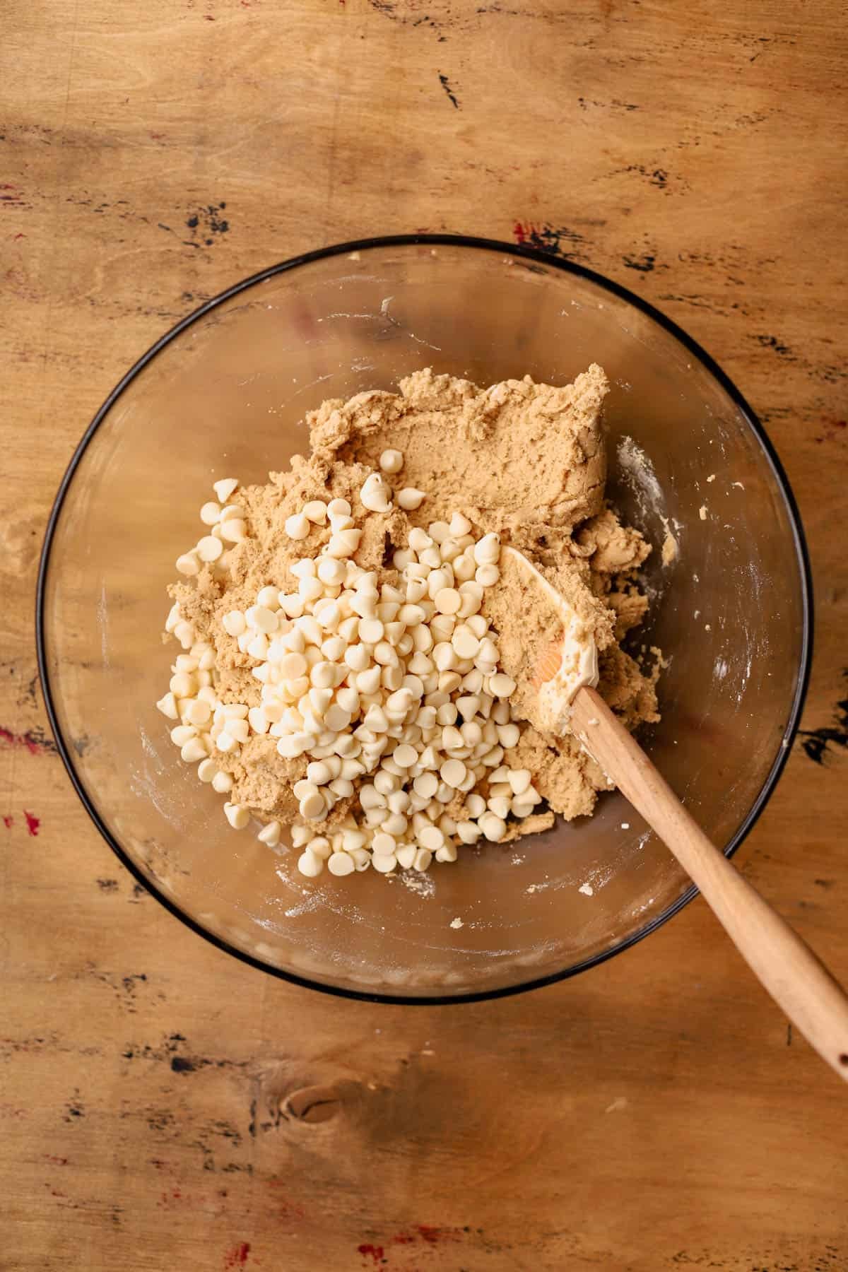Pumpkin cookie batter with white chocolate chips.