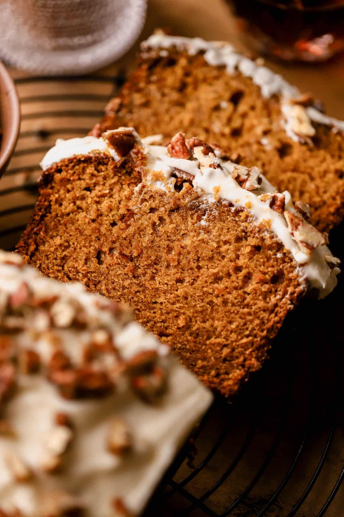 Frosted pumpkin bread with brown butter, pumpkin pie spice, maple syrup, brown sugar, cream cheese frosting and candied pecans. 
