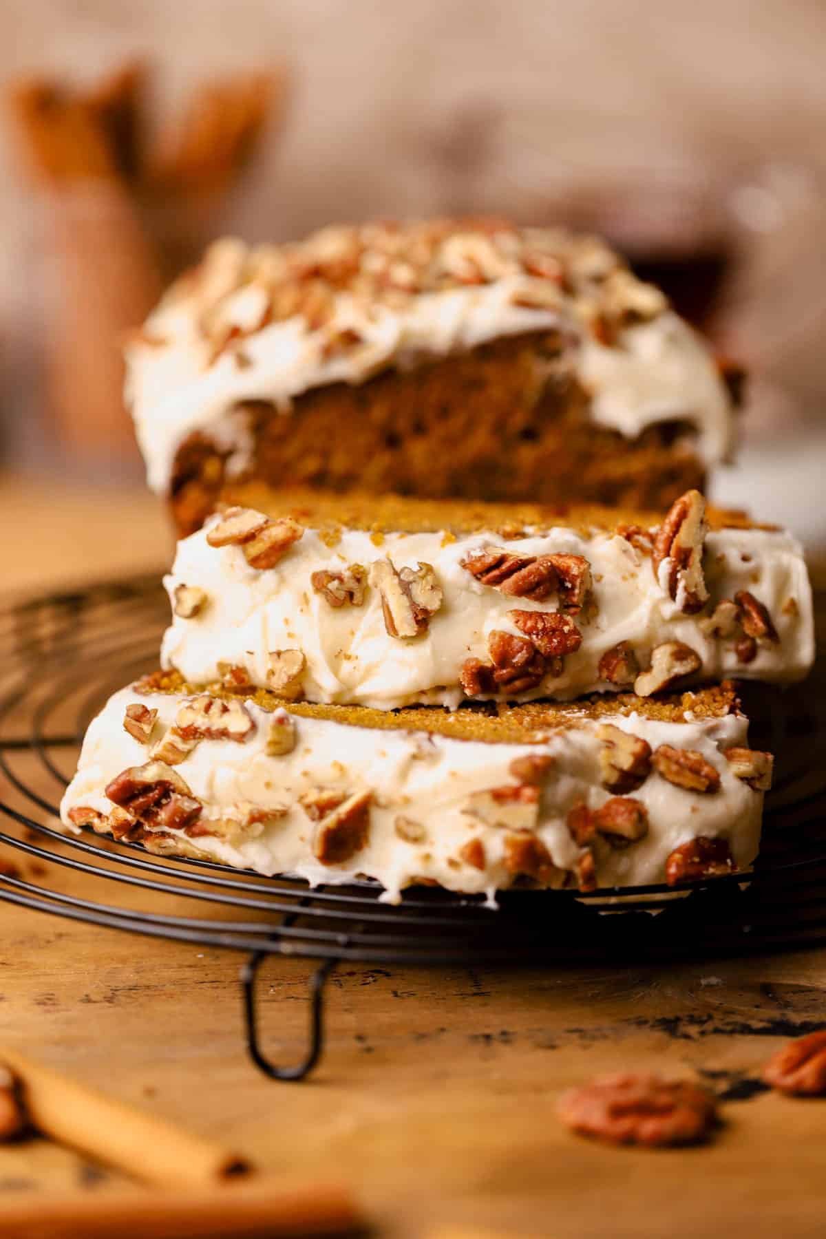 Frosted pumpkin bread with brown butter, pumpkin pie spice, maple syrup, brown sugar, cream cheese frosting and candied pecans. 