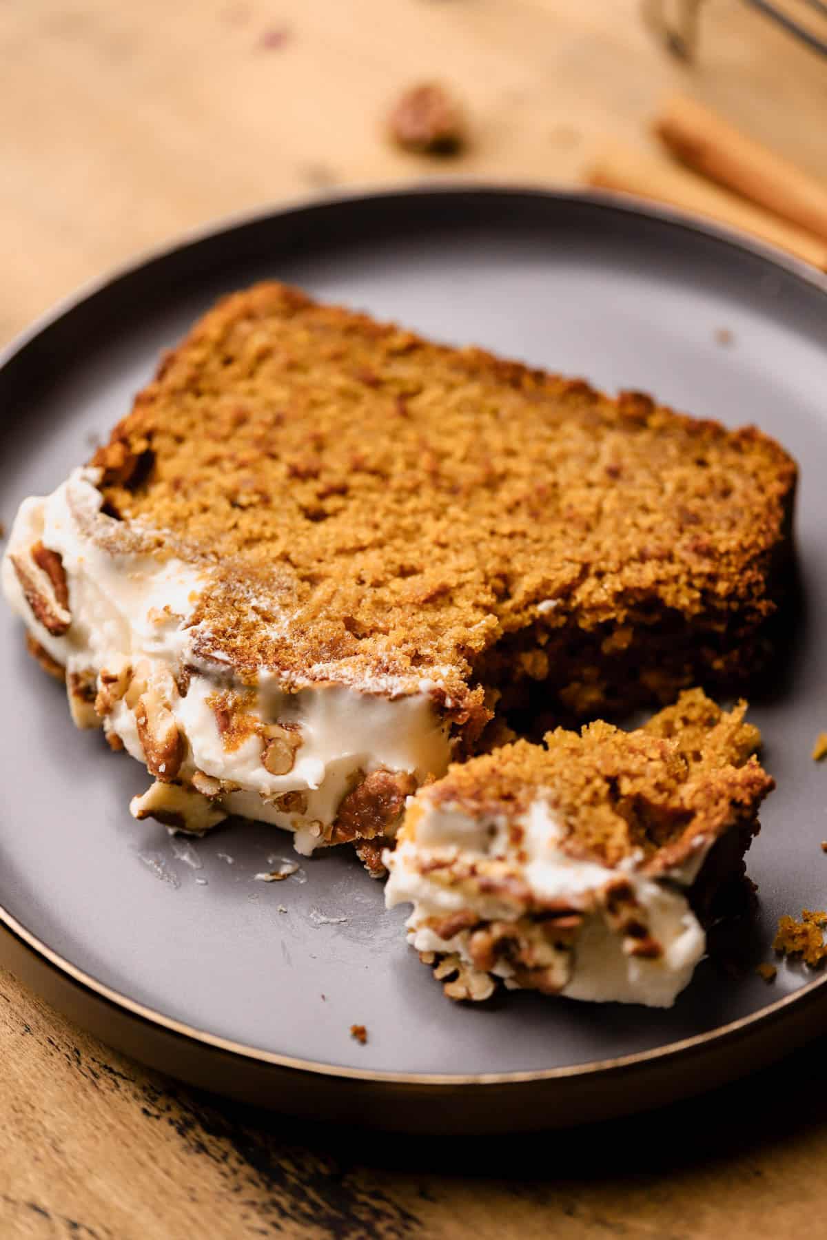Frosted pumpkin bread with brown butter, pumpkin pie spice, maple syrup, brown sugar, cream cheese frosting and candied pecans. 