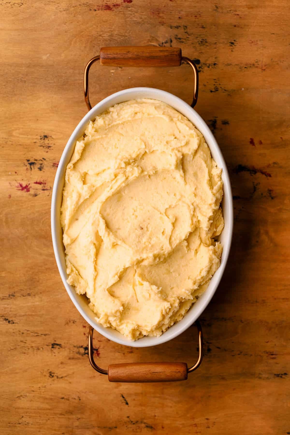 Mashed potatoes in casserole dish.