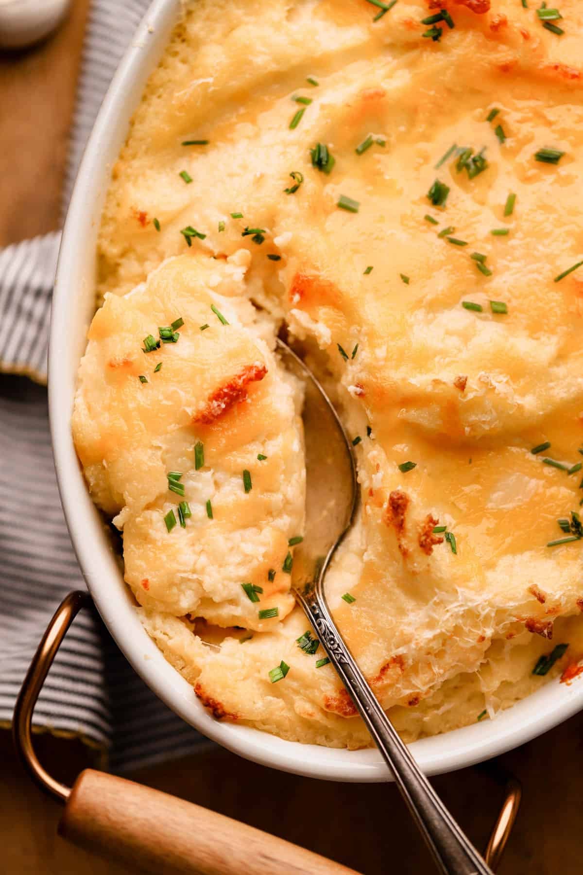Mashed potatoes with cheddar, parmesan, sour cream, roasted garlic and fresh chives. 