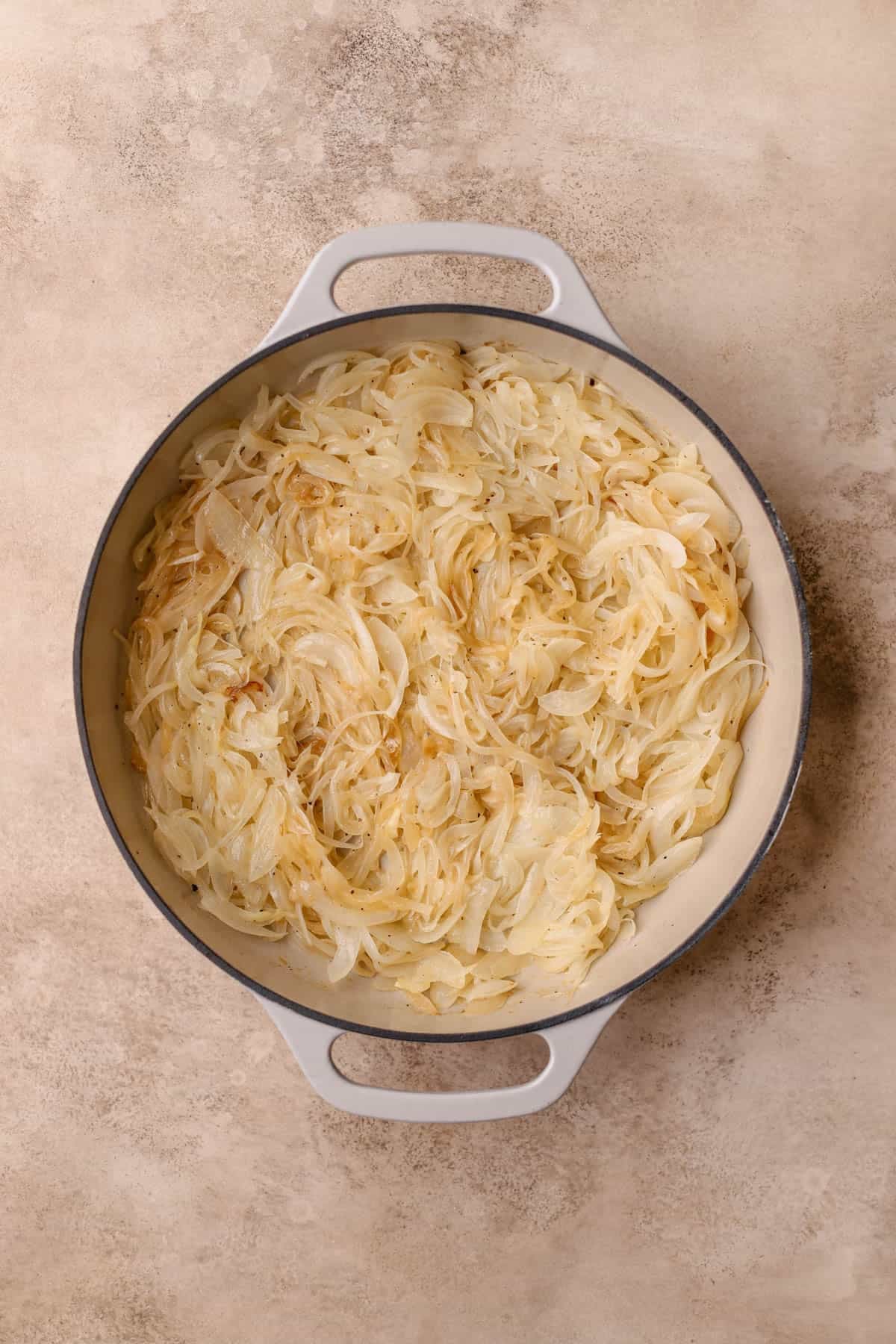 Butter, oil, and sliced yellow onions. 