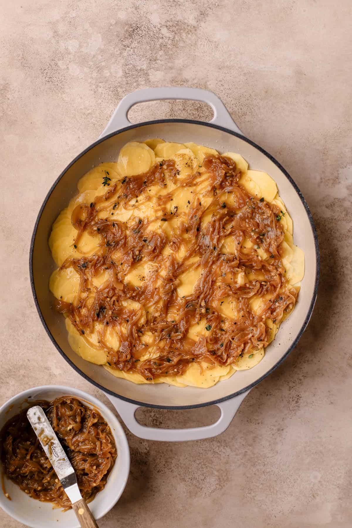 Sliced gold potatoes with caramelized onions.