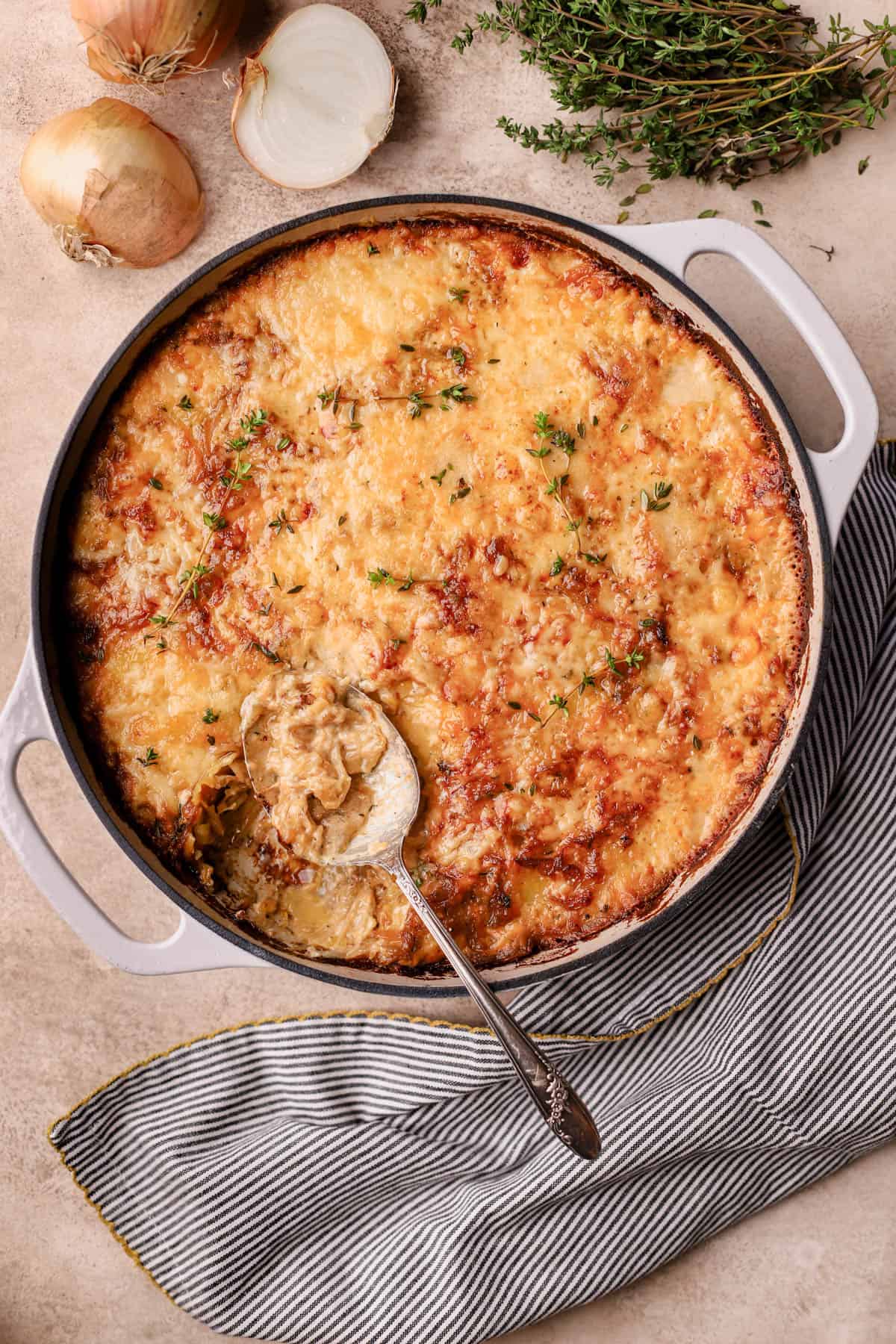 French onion soup potatoes are made with caramelized onions, white wine, fresh thyme, milk, cream, Gruyere, cheddar and Parmesan cheese.