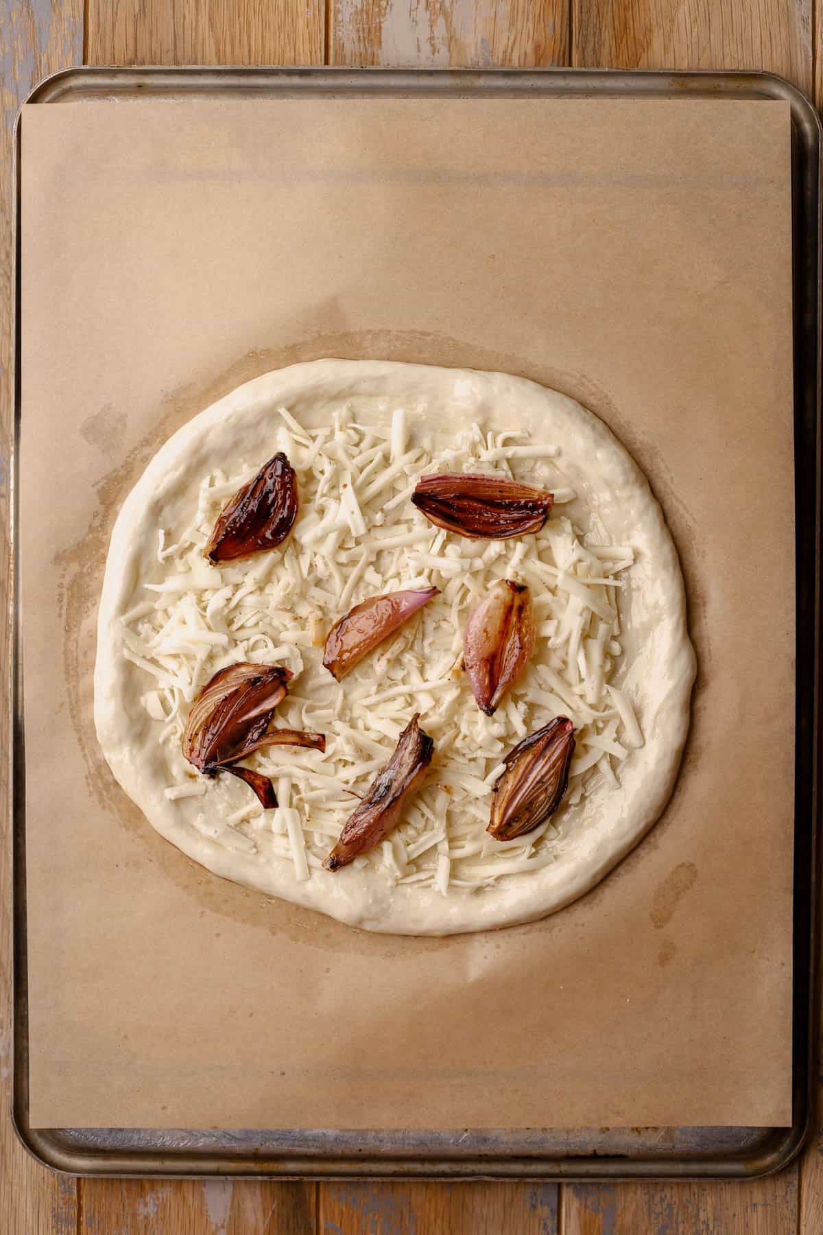 Pizza dough with fontina cheese and caramelized shallots.