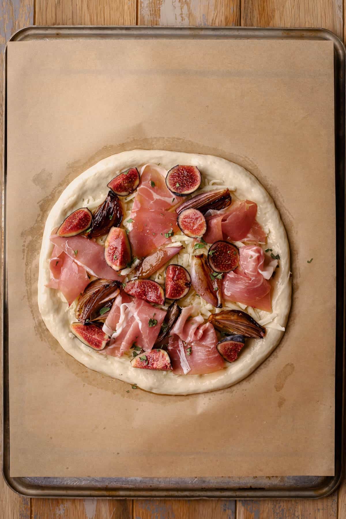 Pizza dough, fresh figs, prosciutto, oregano, balsamic shallots and fontina cheese.
