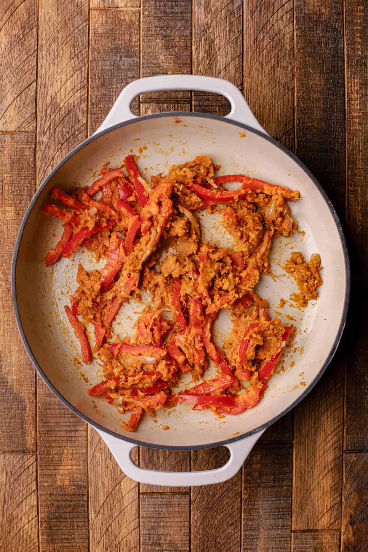Sauteed shallots, garlic, ginger, yellow curry paste, pumpkin puree, and red bell peppers. 
