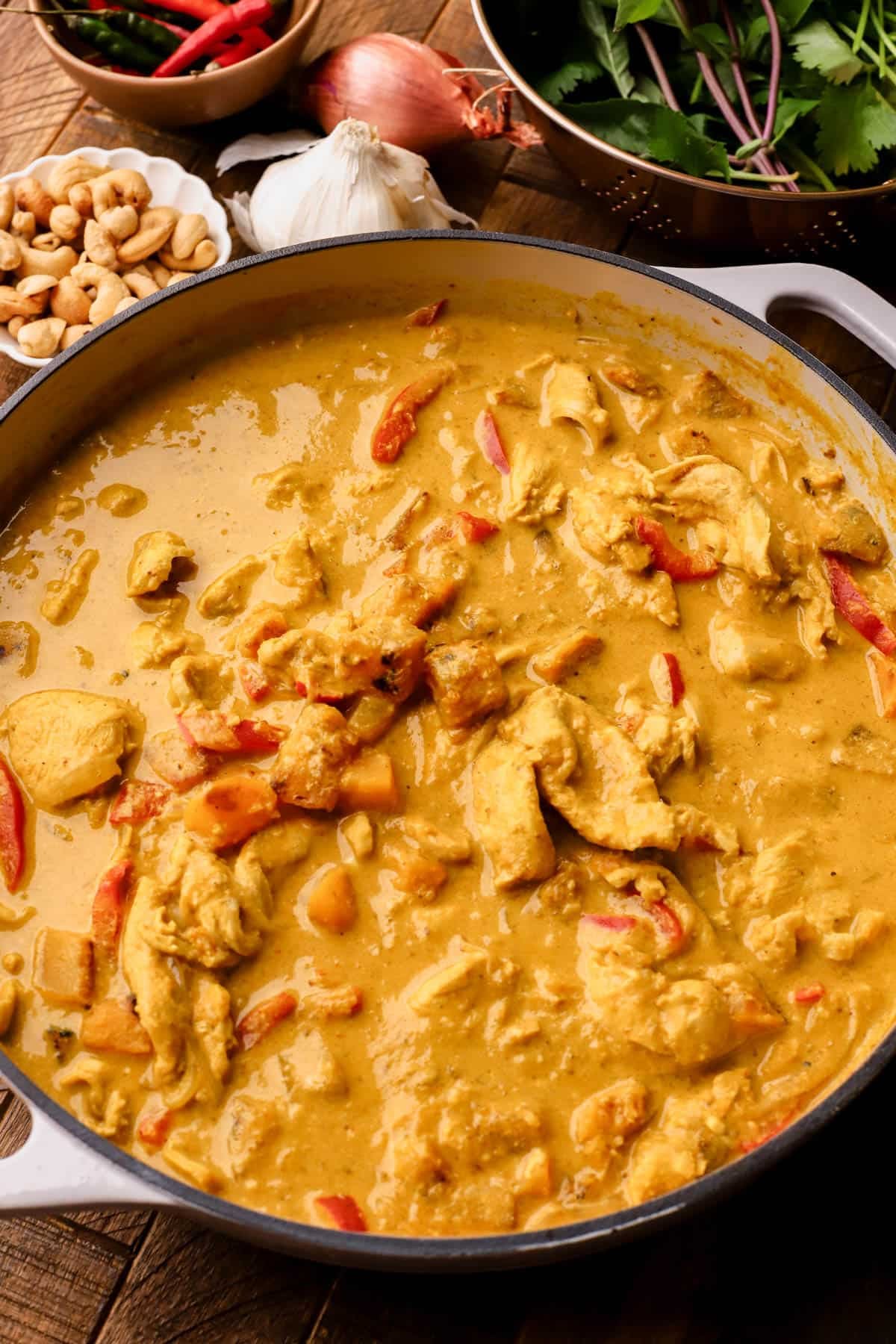 Pumpkin chicken curry is made with yellow curry paste, coconut milk, bell peppers, butternut squash, fresh herbs and toasted cashews. 