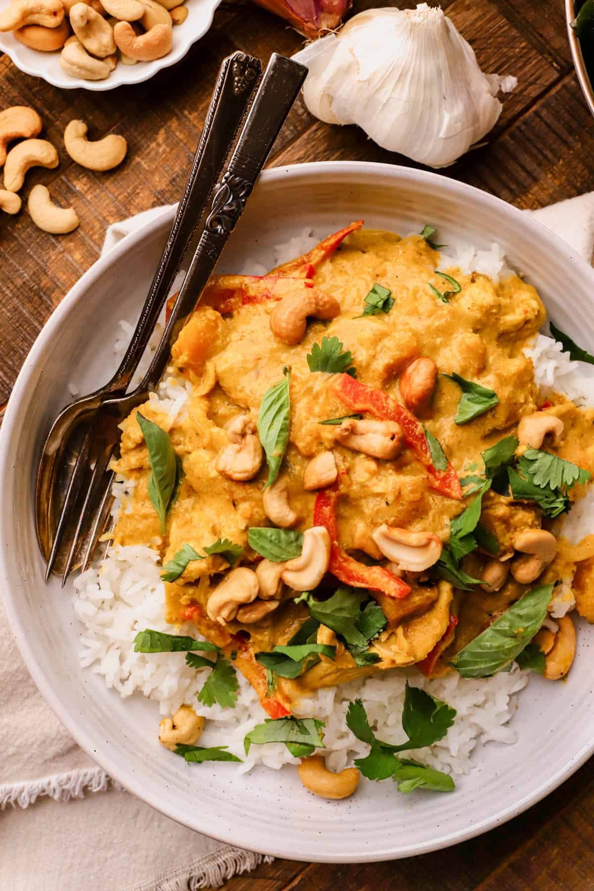 Pumpkin chicken curry is made with yellow curry paste, coconut milk, bell peppers, butternut squash, fresh herbs and toasted cashews. 