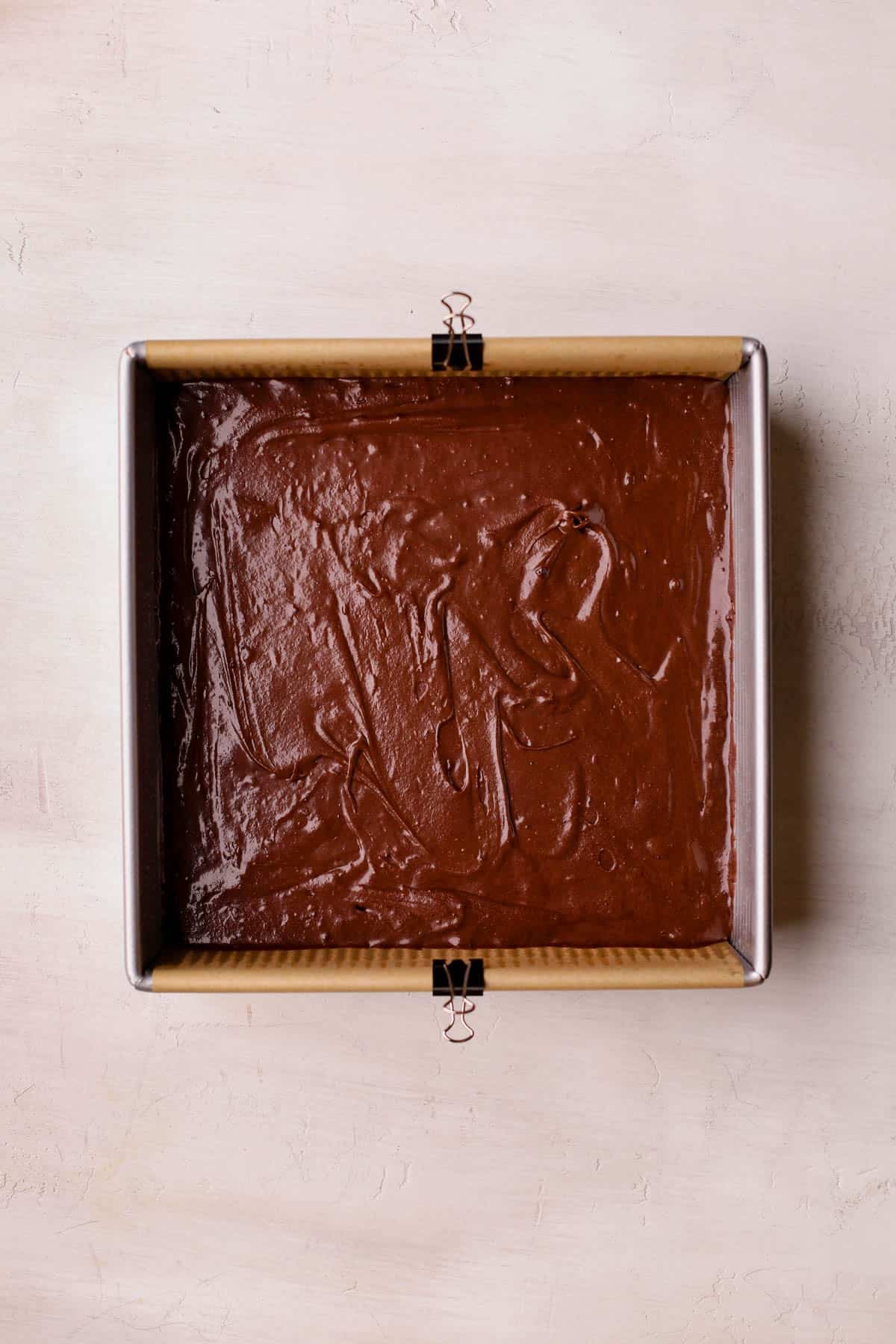Brownie batter in 9x9 baking pan.