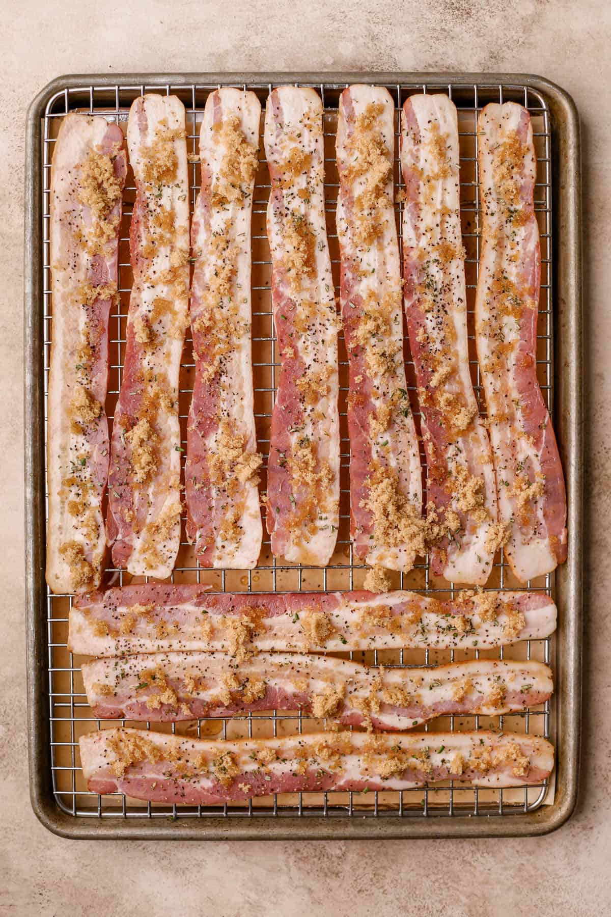 Bacon brushed with maple syrup, rosemary, pepper, brown sugar, and paprika.