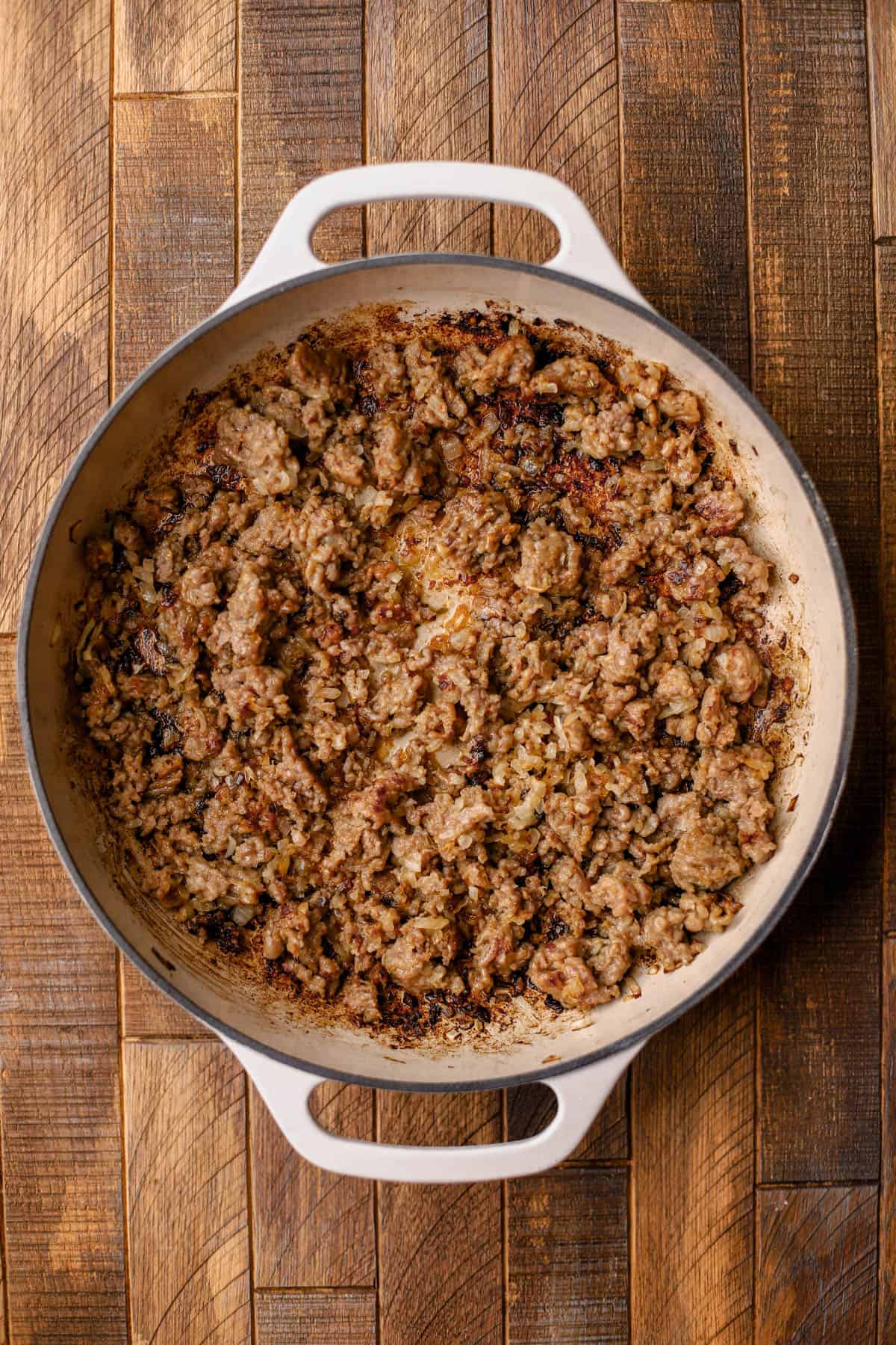 Browned Italian sausage, olive oil, and yellow onions.