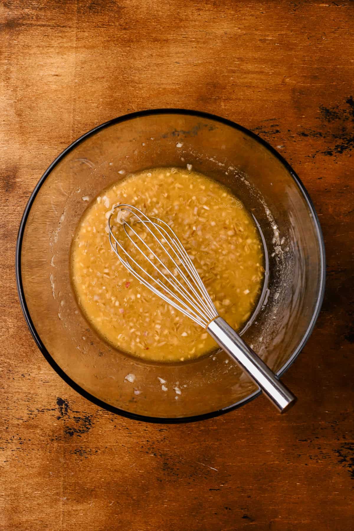 Apple cider, apple cider vinegar, olive oil, shallots maple syrup, and dijon mustard. 