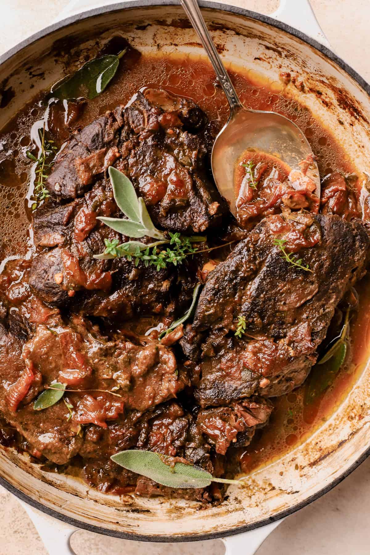 Cider braised pot roast with caramelized onions, fresh thyme, sage, chicken stock, garlic, apple cider, and apple butter.