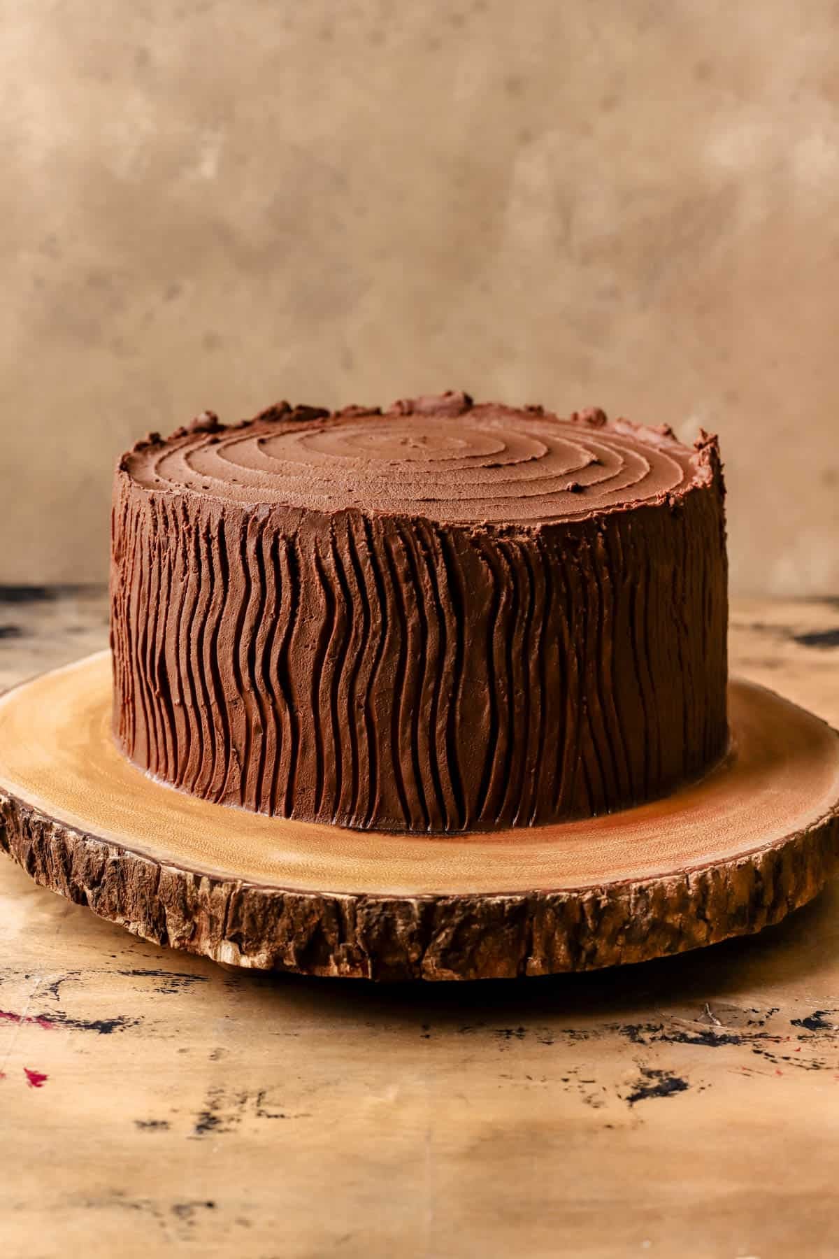 Chocolate cake covered in whipped ganache and forked to resemble Yule log.