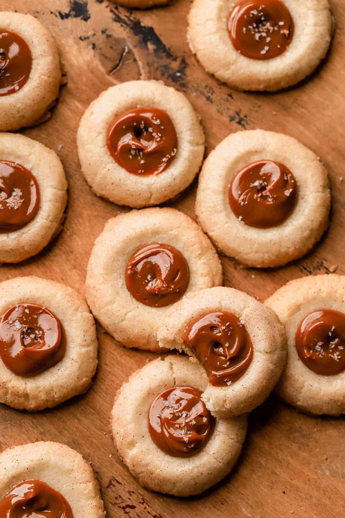 Dulce de leche cookies are thumbprint cookies rolled in cinnamon sugar and filled with dulce de leche. 