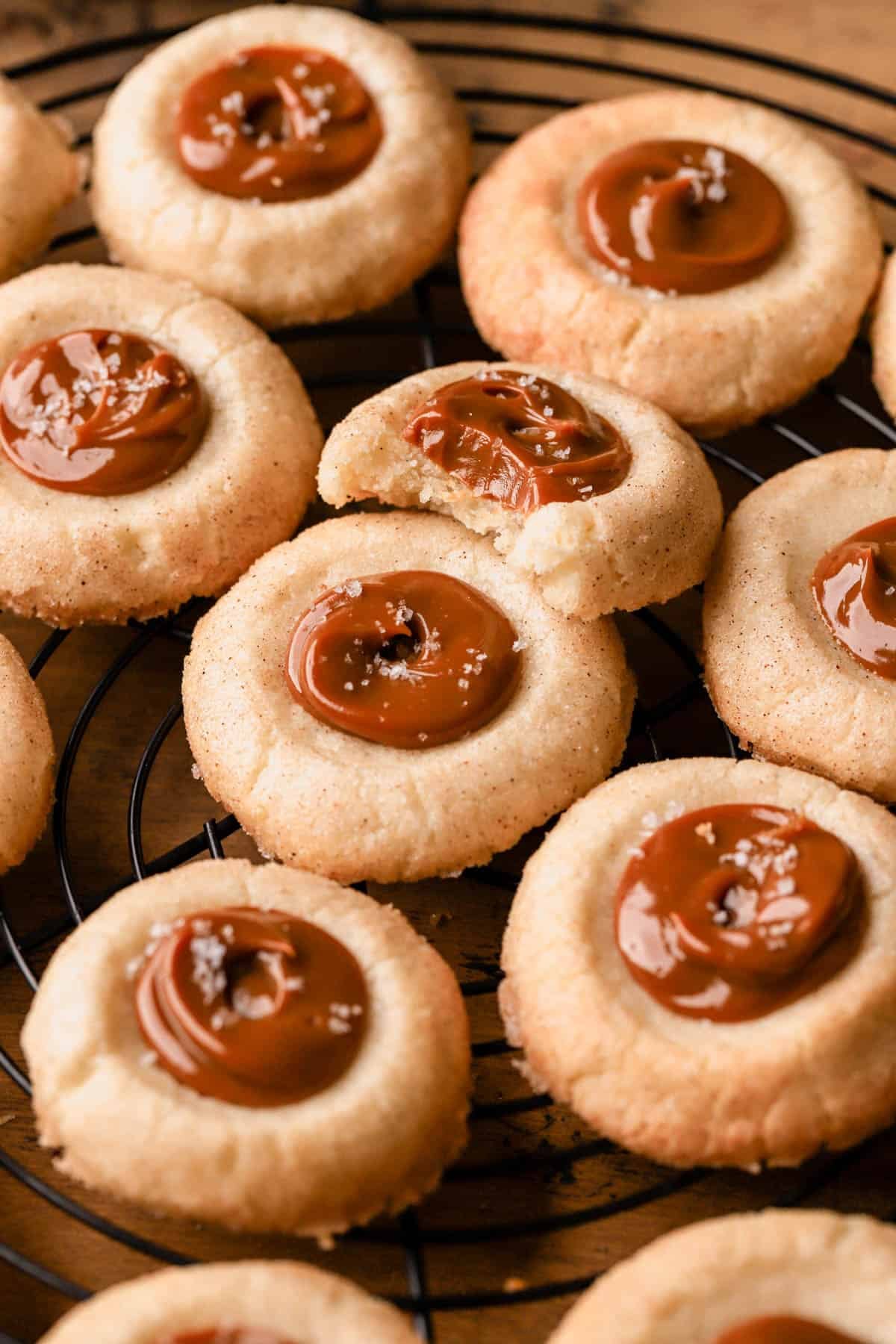 Dulce de leche cookies are thumbprint cookies rolled in cinnamon sugar and filled with dulce de leche. 