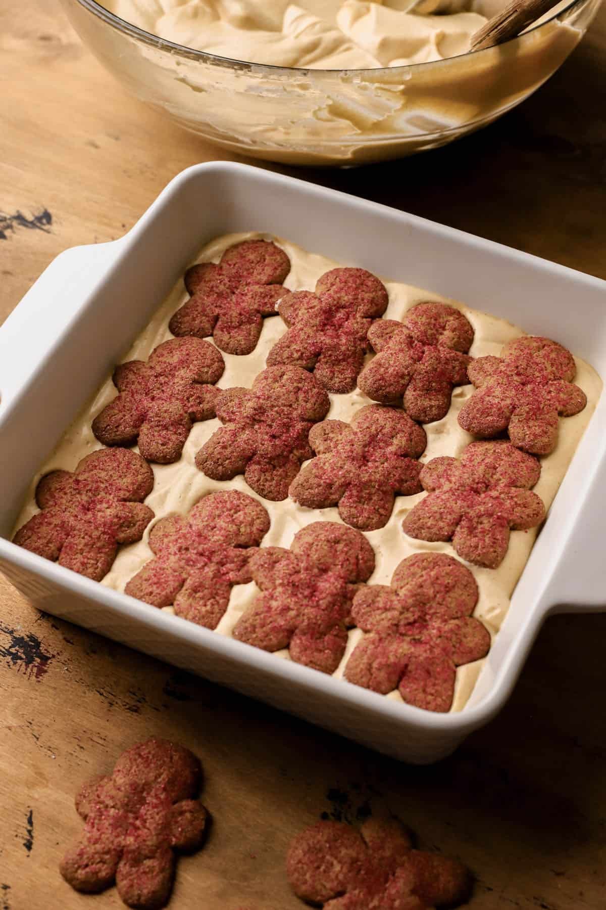 Gingerbread tiramisu with espresso-soaked ladyfingers, crisp gingerman cookies, gingerbread mascarpone cream and dusted with cocoa powder. 