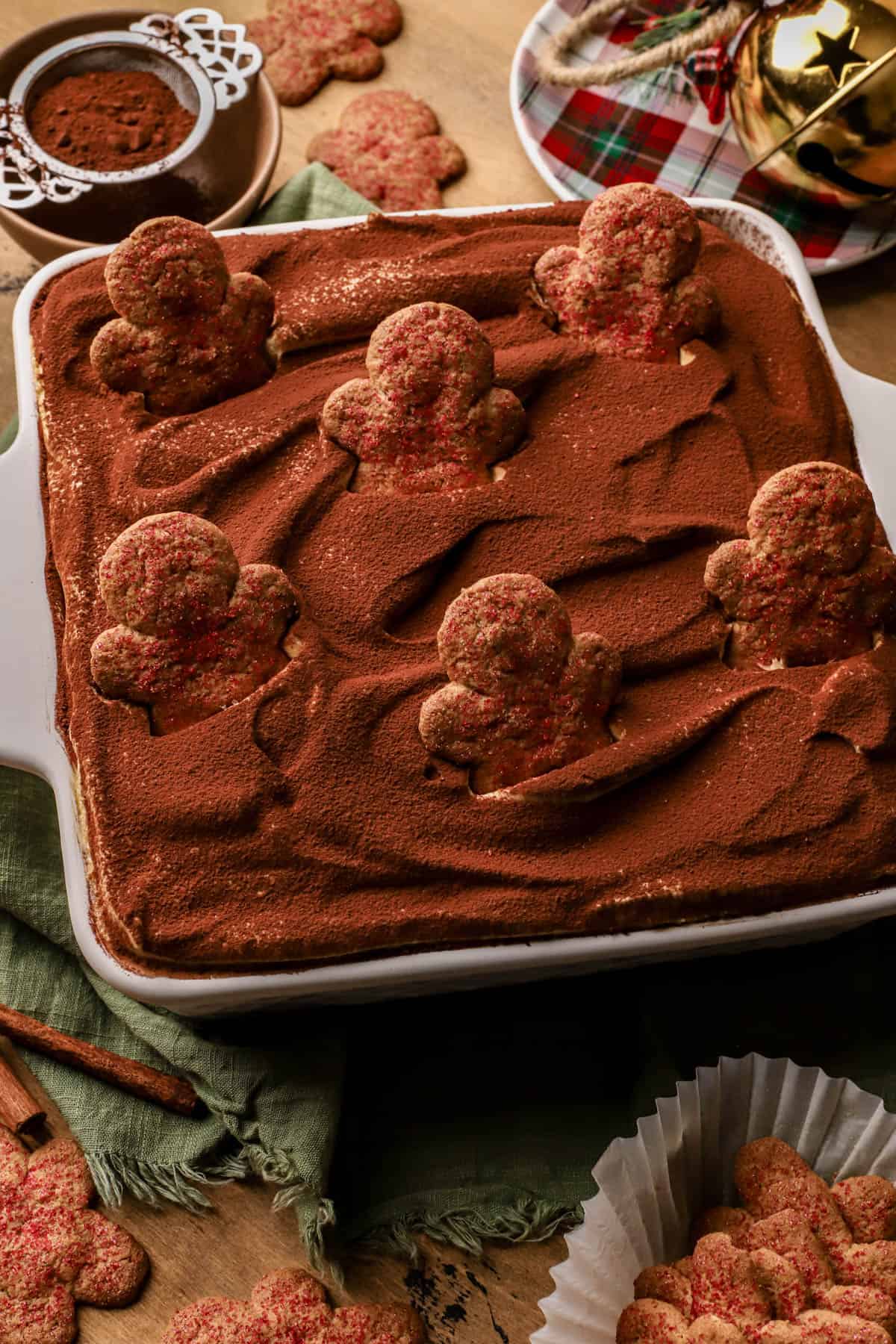 Gingerbread tiramisu with espresso-soaked ladyfingers, crisp gingerman cookies, gingerbread mascarpone cream and dusted with cocoa powder. 