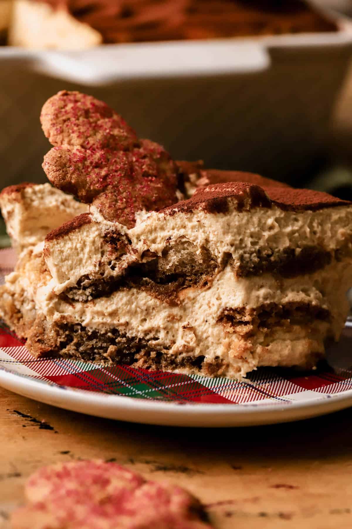 Gingerbread tiramisu with espresso-soaked ladyfingers, crisp gingerman cookies, gingerbread mascarpone cream and dusted with cocoa powder. 