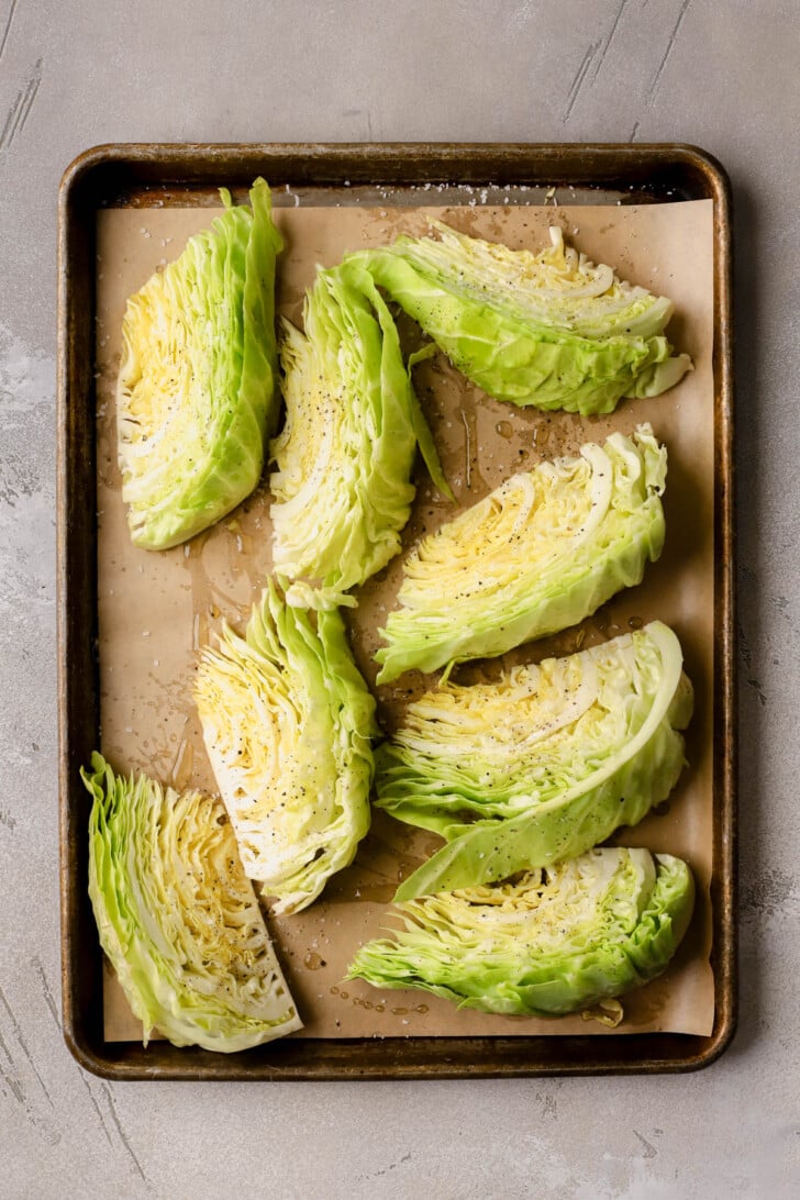 Green cabbage brushed with olive oil and seasoned with salt and pepper. 