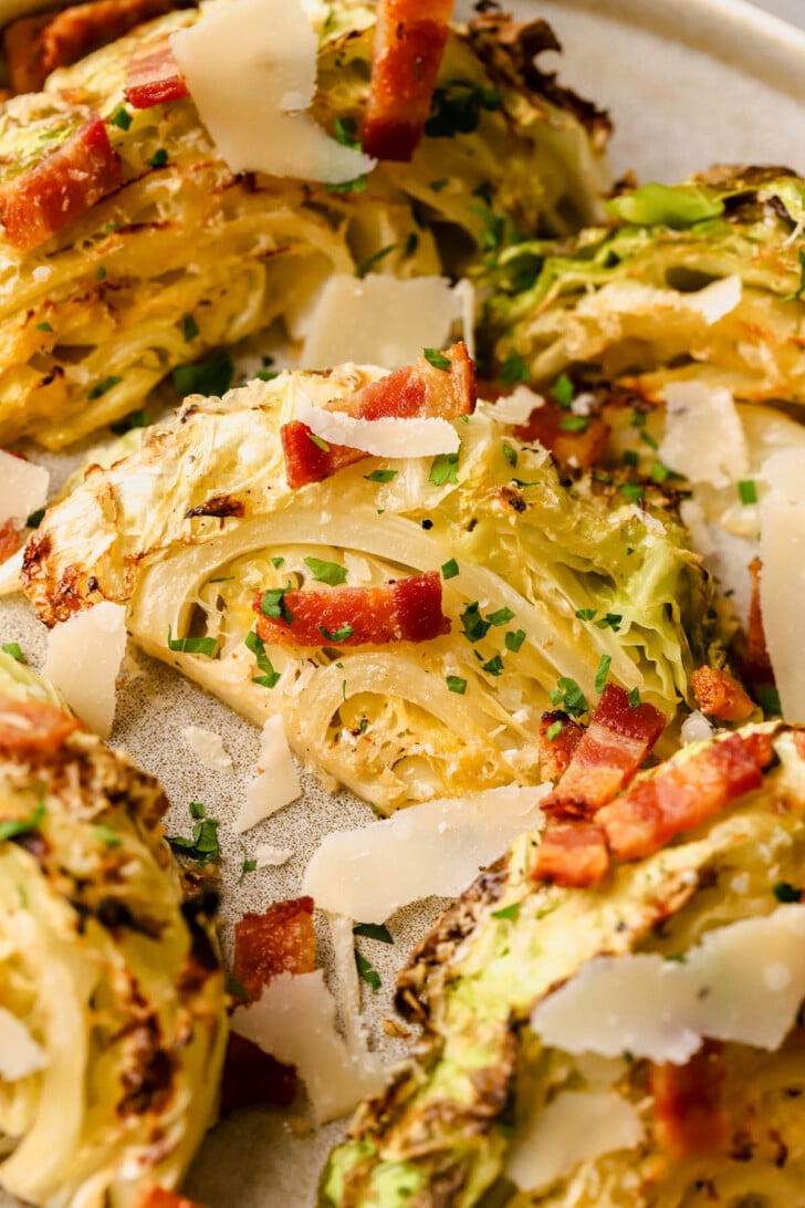 Roasted cabbage wedges sprinkled with bacon, herbs, and parmesan. 