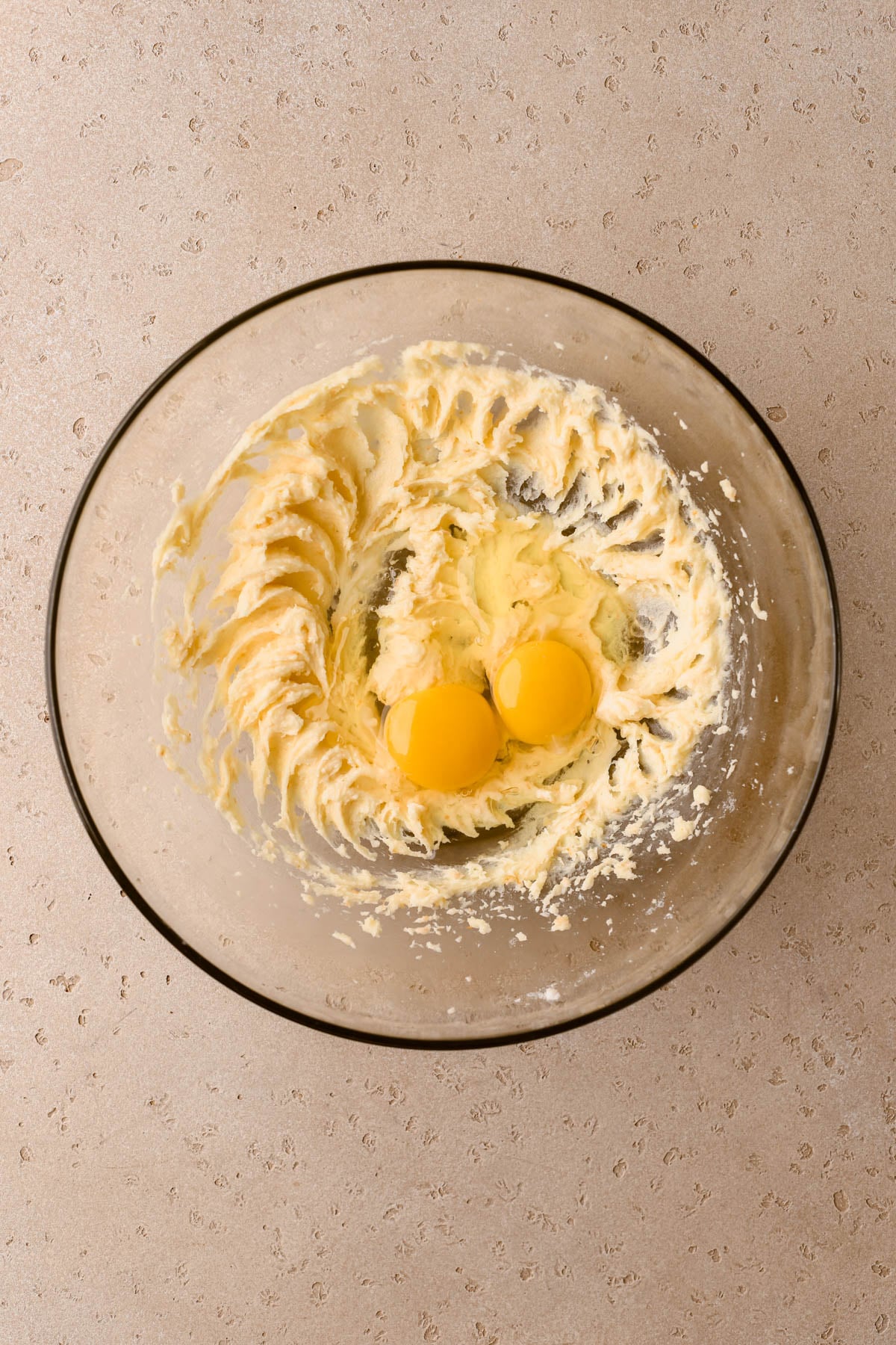 Creamed butter, with eggs, and almond extract. 