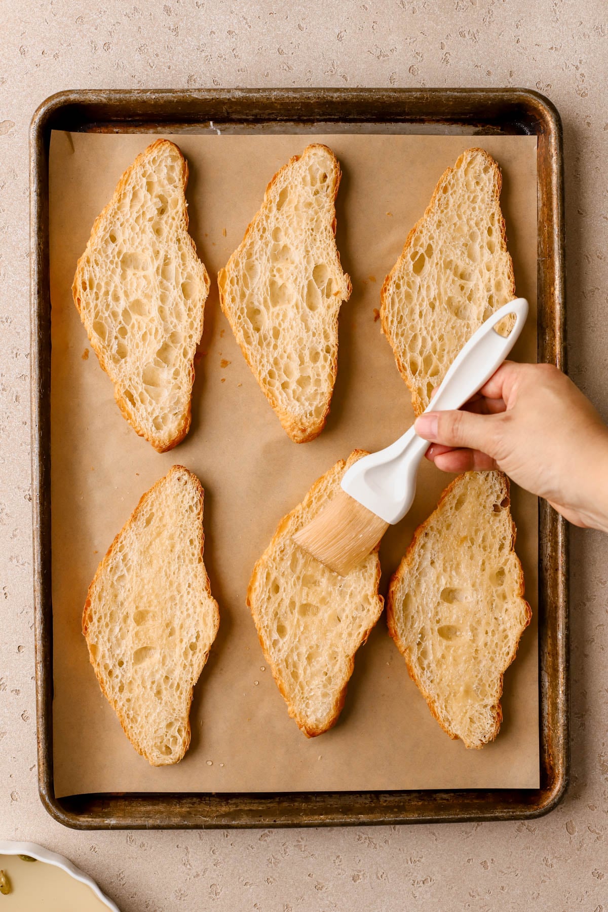 Sliced croissants brushed with orange-cardamom syrup. 