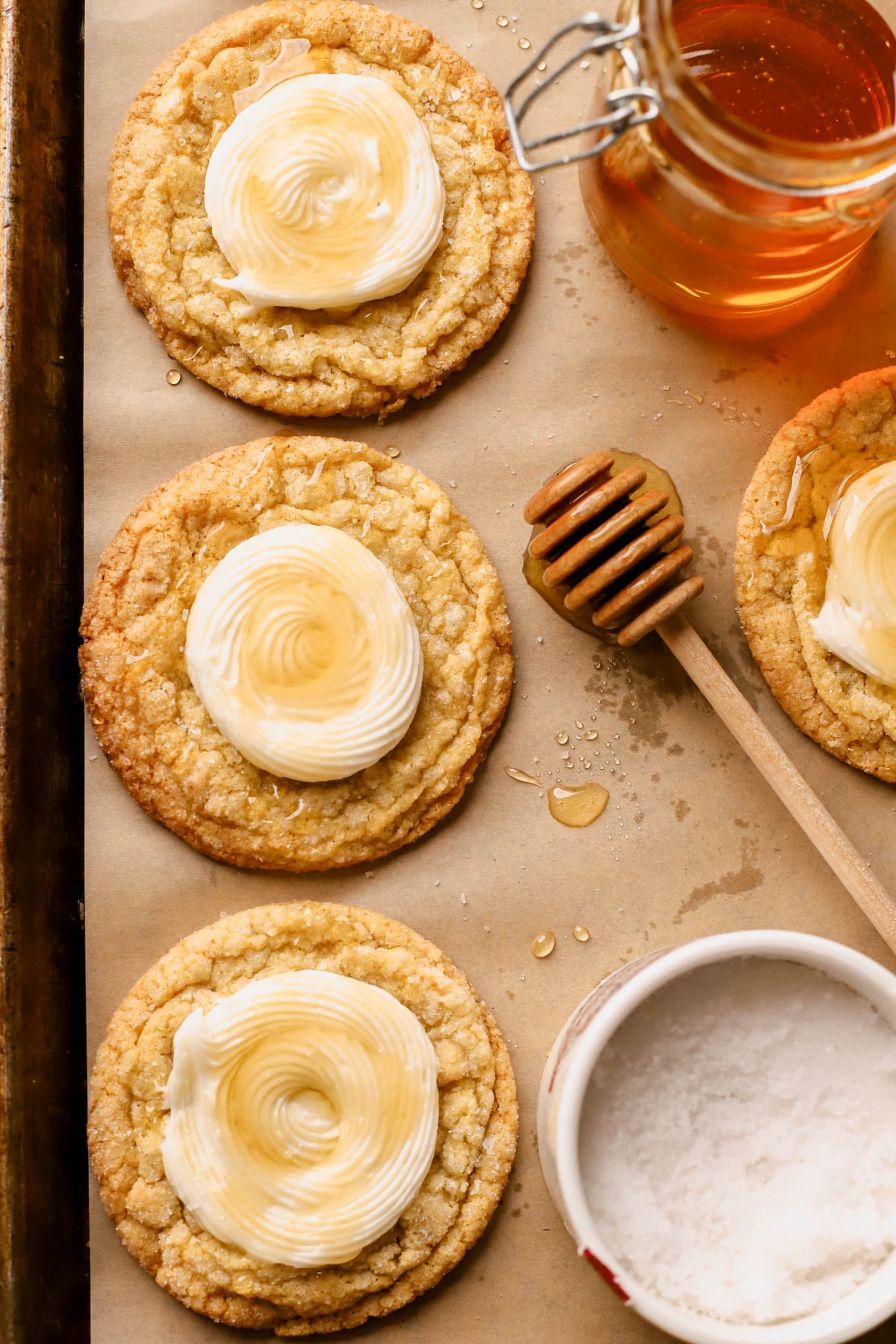 Cornbread cookies piped with a swirl of honey buttercream, then drizzled with honey and flaky sea salt. 
