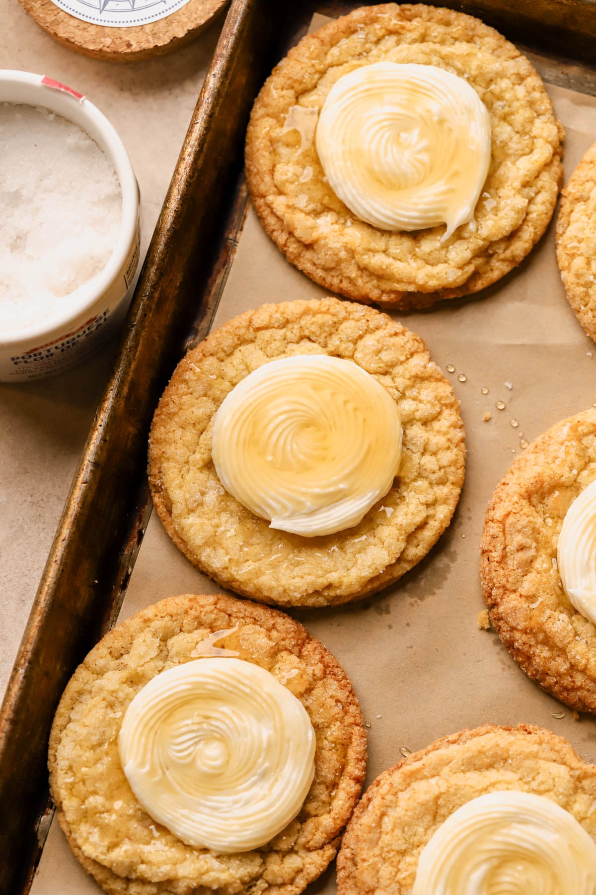 Honey buttercream frosted cornbread cookies with flaky sea salt. 