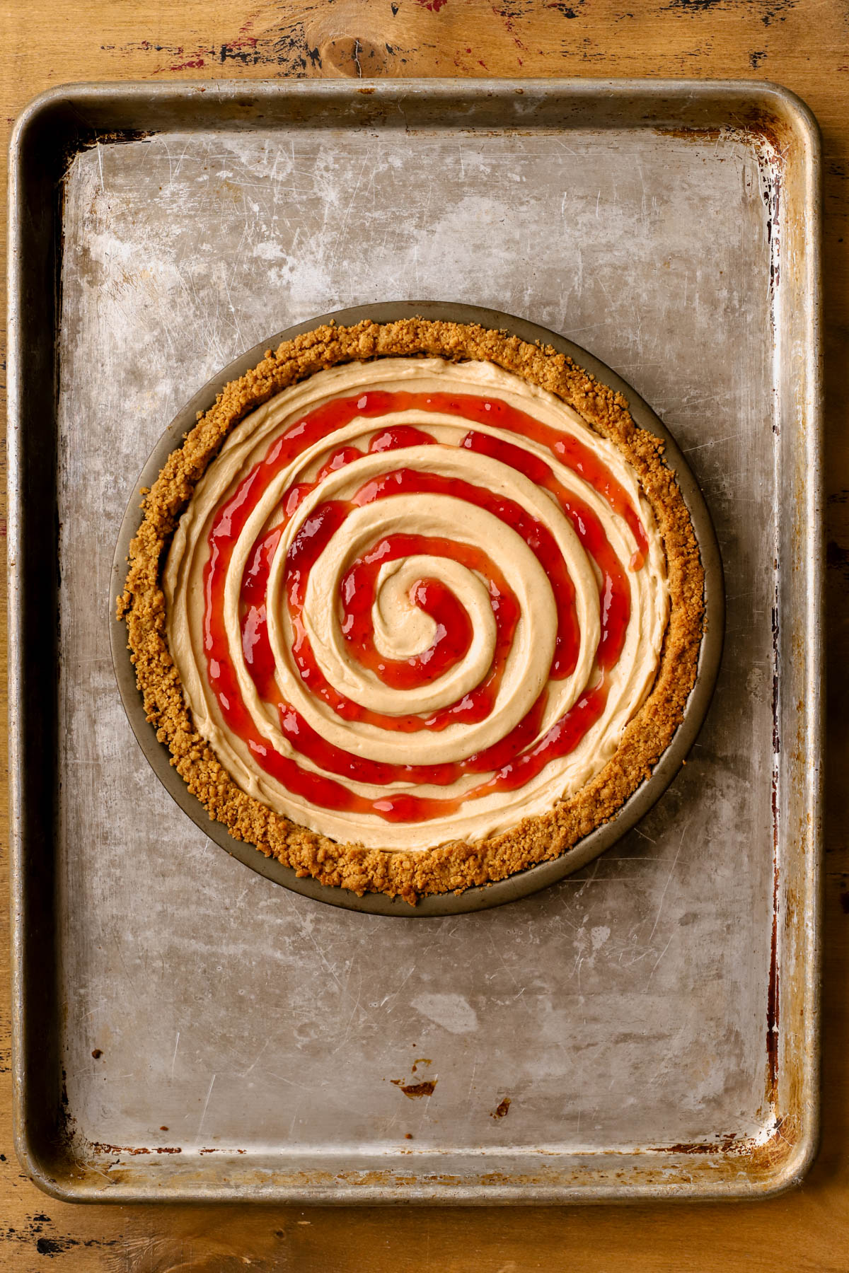 Peanut butter mousse spread into Nutter Butter crust and piped strawberry jam. 