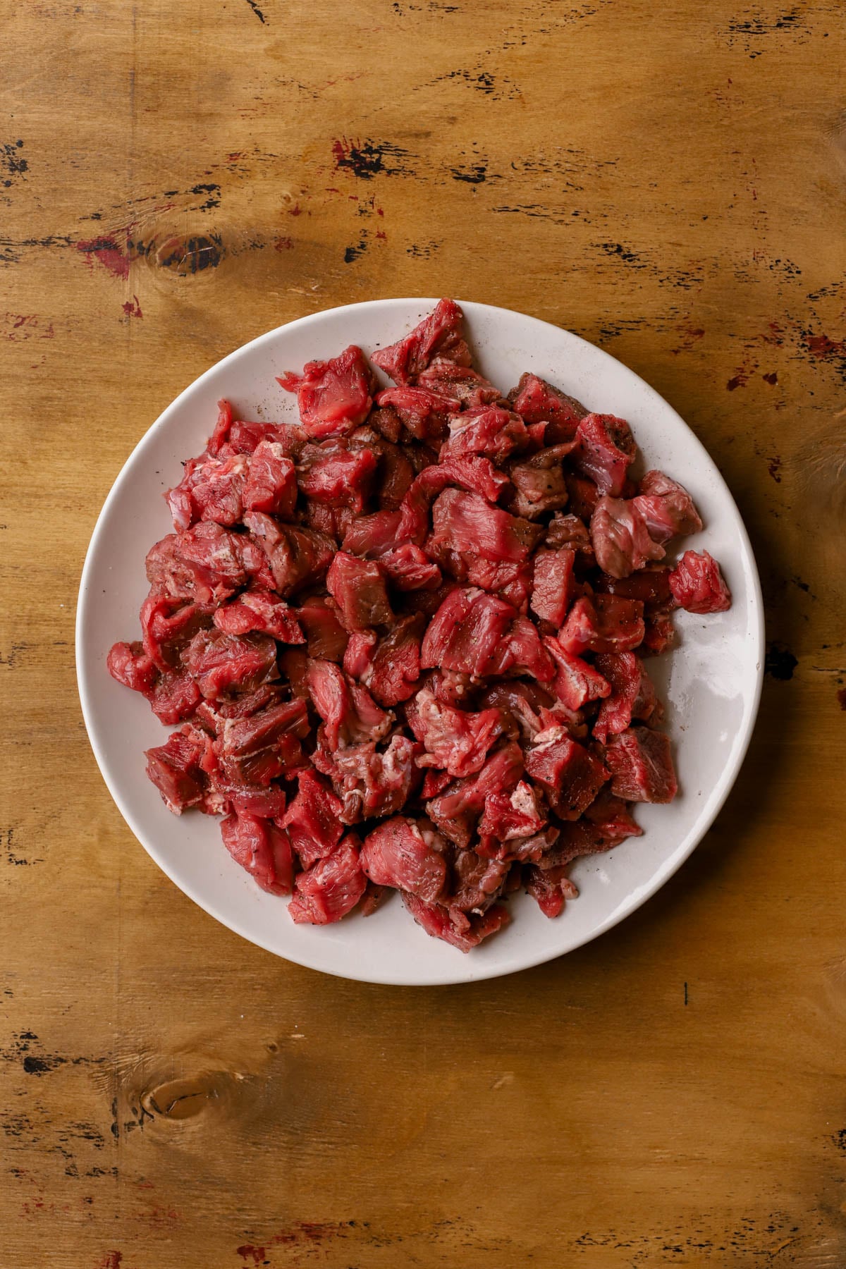 Diced chuck roast with salt and pepper. 