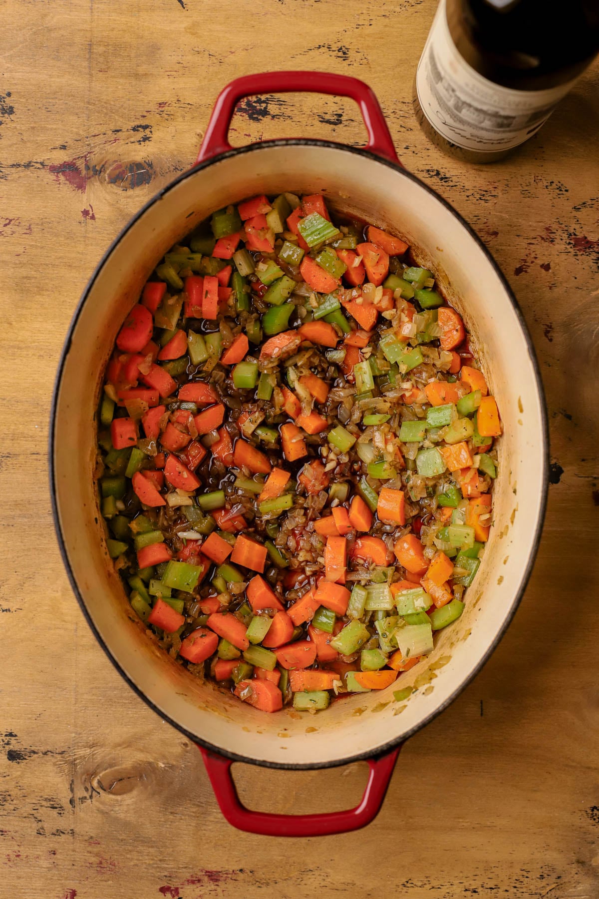 Saut&eacute;ed onions, garlic, celery, carrots, fresh thyme, and rosemary.  Deglazed with red wine.